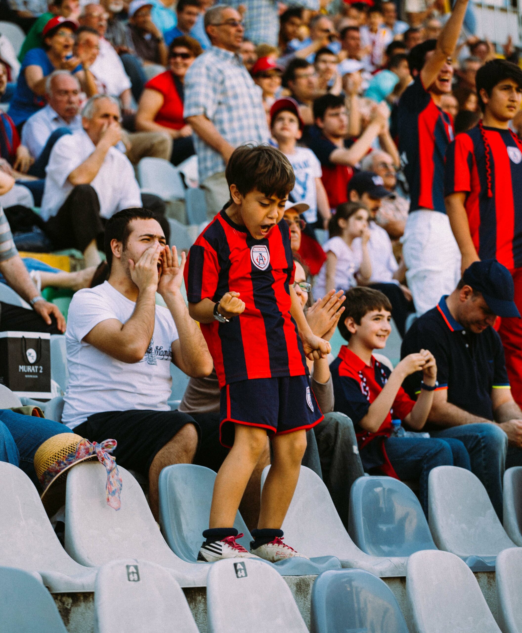 boy celebrating at football match 